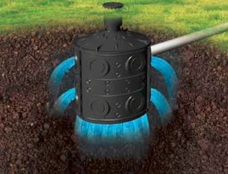 Outdoor Splendor - A black underground irrigation system releases streams of blue water into surrounding soil, with grass visible above the surface.